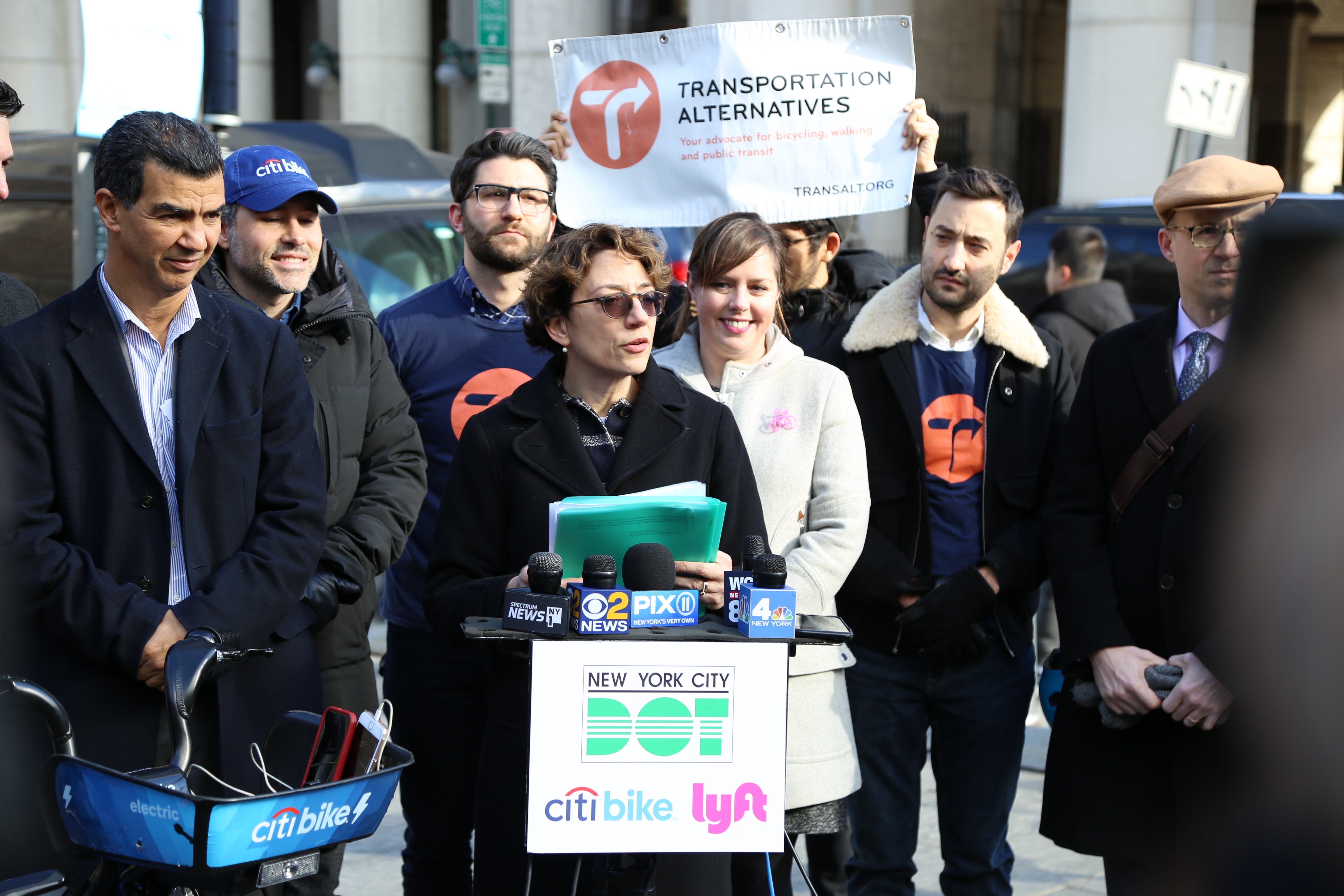 Polly Trottenberg at speaking at the news of the Citi Bike expansion. Surrounding her are members of Lyft, Citi Bike and Transportation Alternatives.  