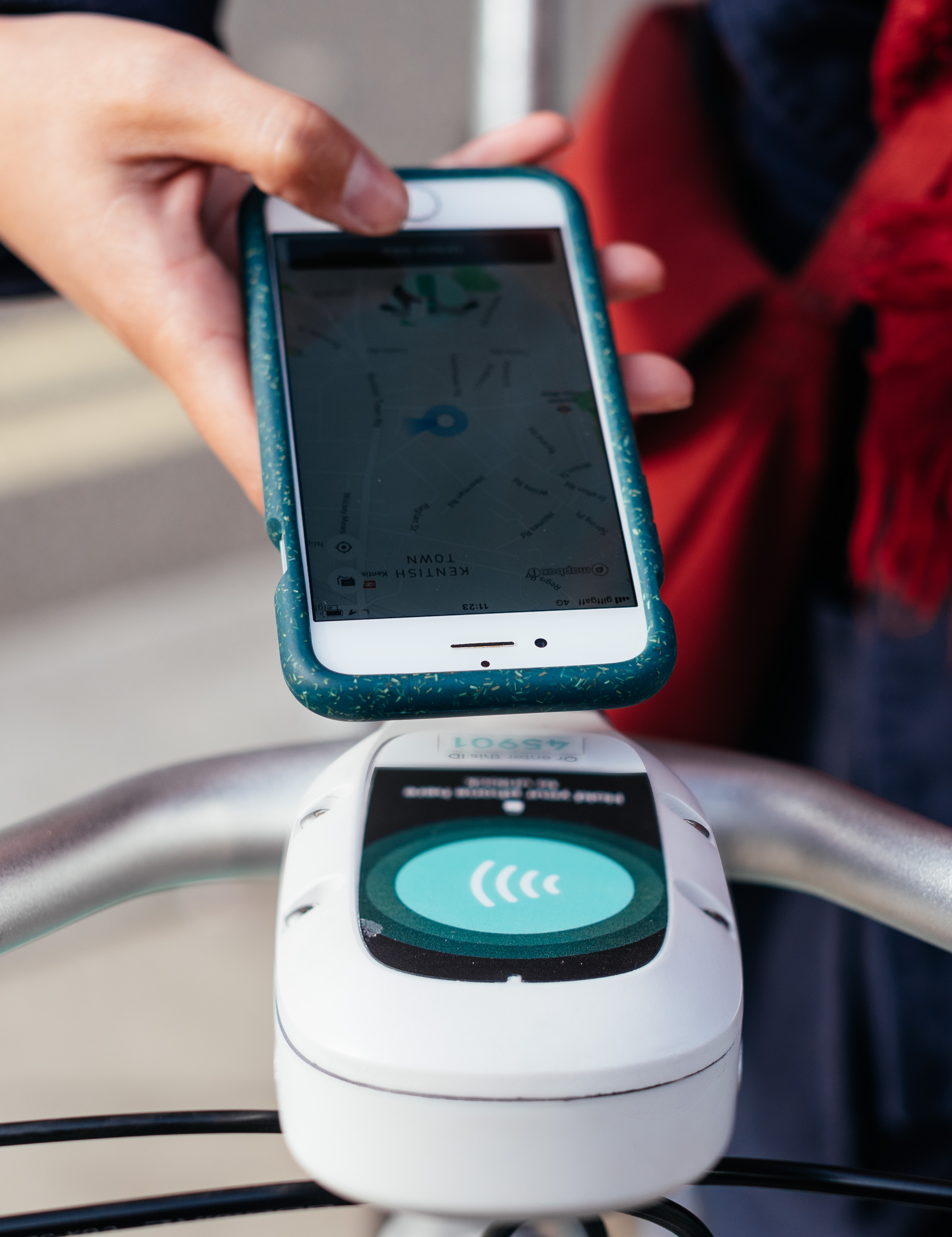An image of a phone with a Beryl bike close by