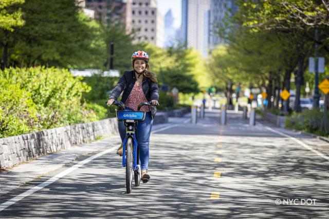 A person riding a Citi Bike on the Hudson River Greenway